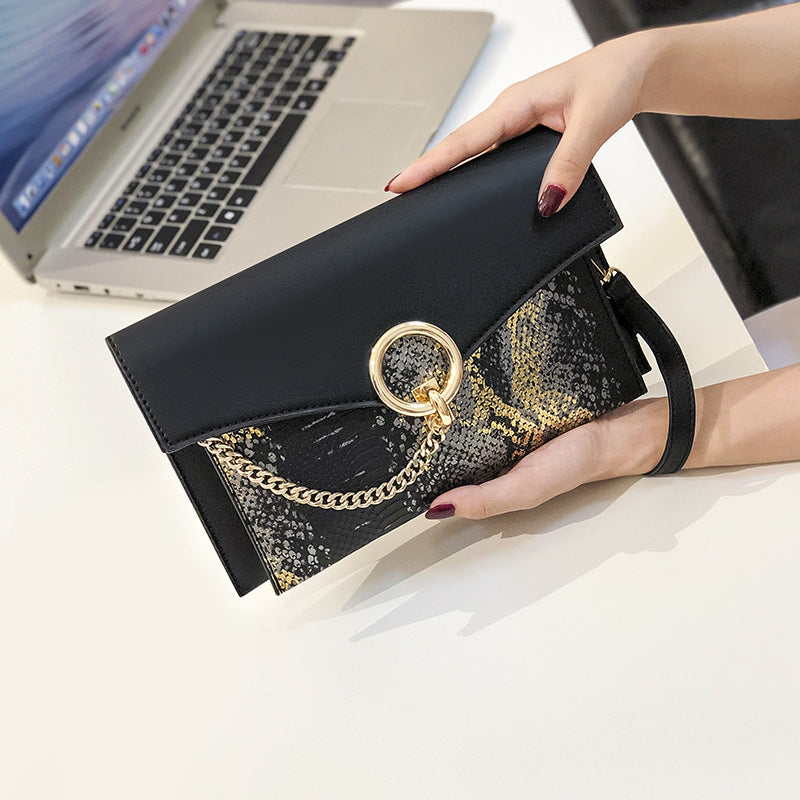 snake pattern clutch Bag