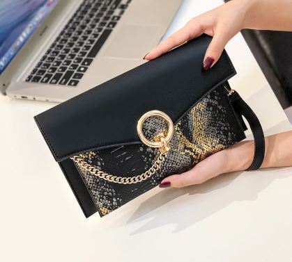 snake pattern clutch Bag